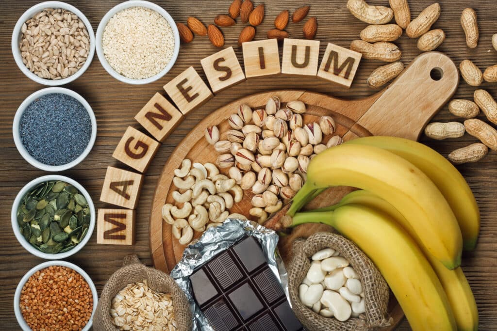 Foods high in magnesium, including nuts, seeds, bananas, and leafy vegetables