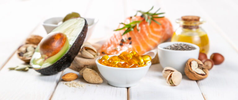 Omega-3 capsules, salmon, avocado, and nuts representing anti-inflammatory foods used in modern treatment of depression.