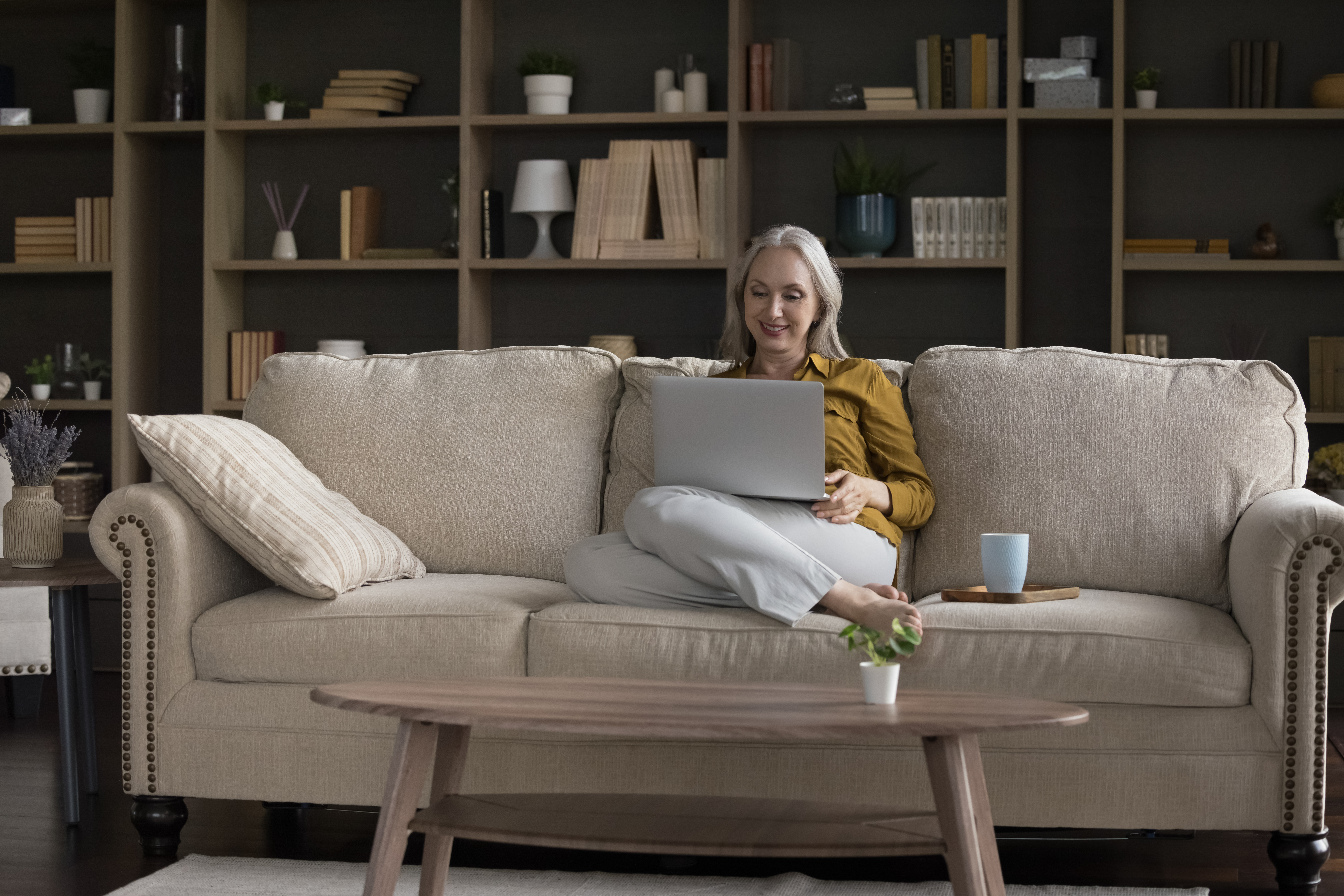 Woman having telehealth psychiatry appointment on laptop at home in Northern Virginia