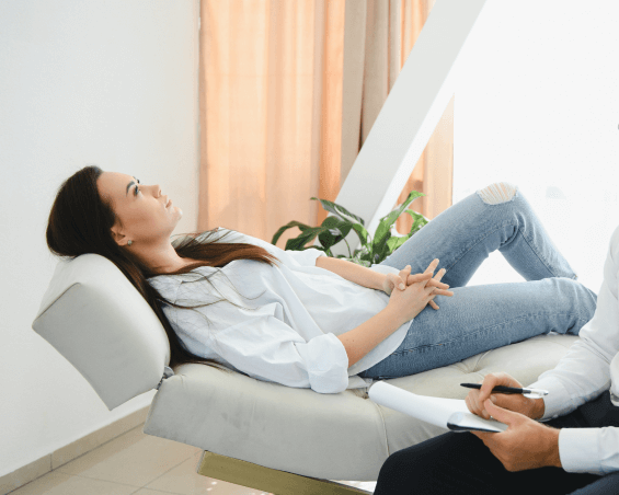 Board-certified psychiatrist discussing PTSD via telehealth