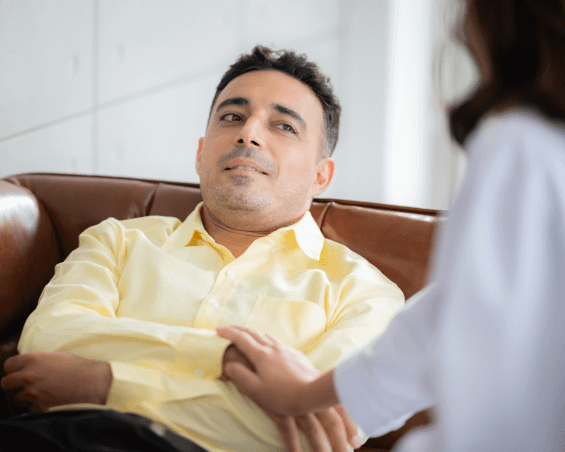 Board-certified psychiatrist discussing psychotic disorder care via telehealth-1